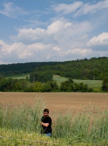 Keegan, Production Management Intern, in the rye field.